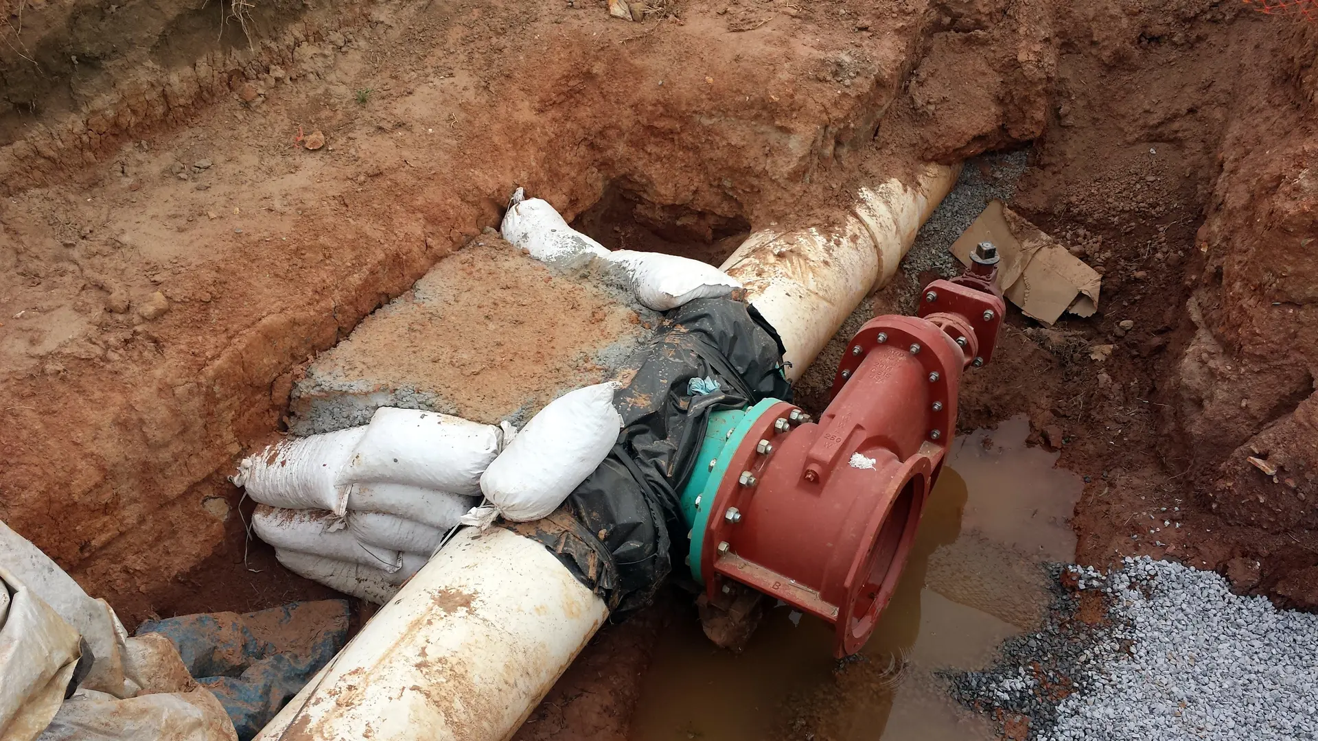 Emergency plumber responding to burst pipe